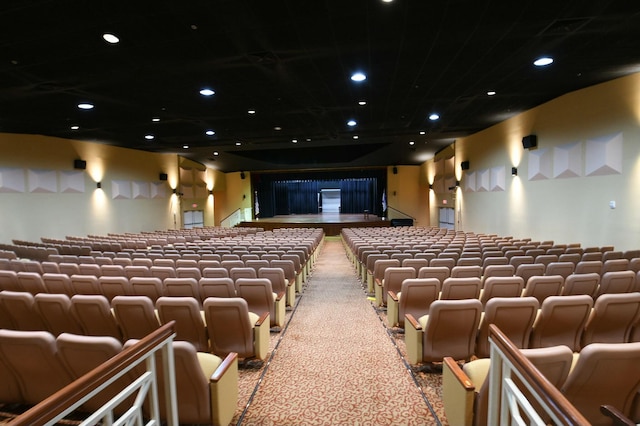 home theater with light colored carpet