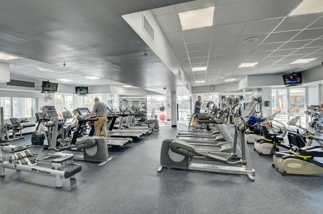 exercise room featuring a paneled ceiling