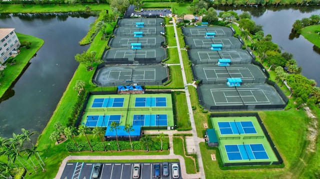 birds eye view of property with a water view