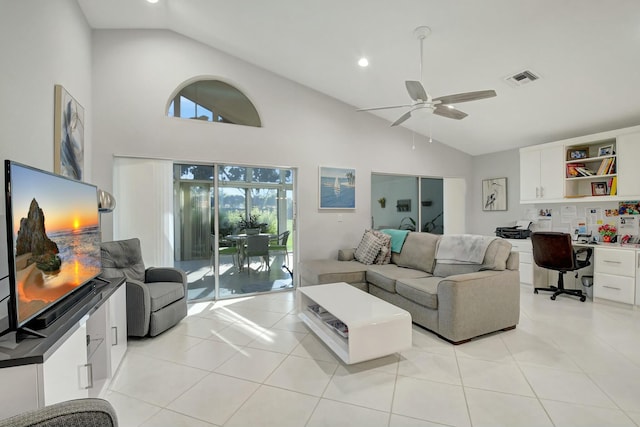 tiled living room featuring ceiling fan and high vaulted ceiling