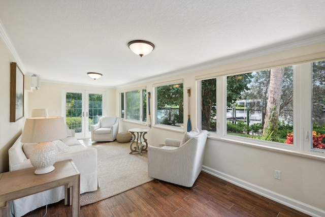 sunroom featuring a wealth of natural light and french doors