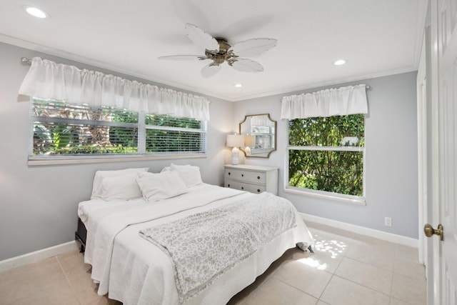 bedroom with multiple windows, ceiling fan, and ornamental molding