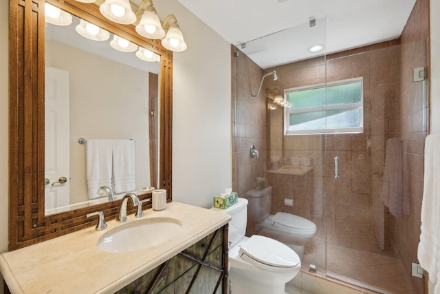 bathroom with toilet, an enclosed shower, and vanity