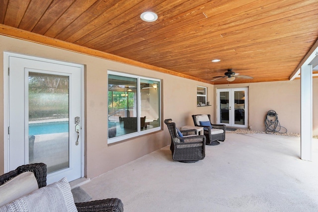 view of patio with ceiling fan and french doors