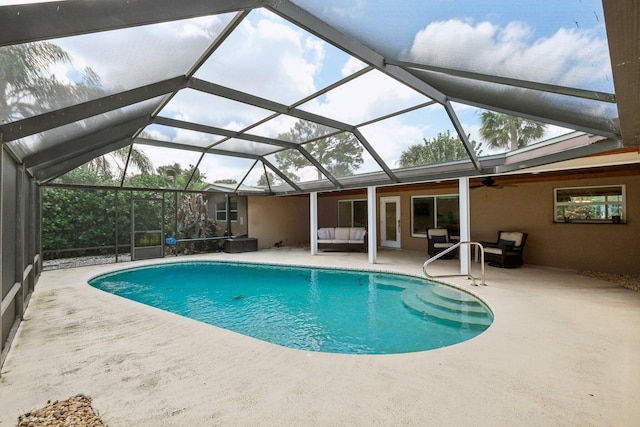 view of swimming pool with a lanai and a patio area