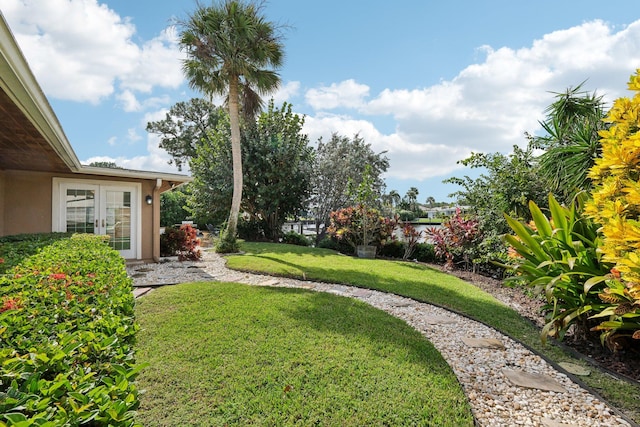 view of yard with french doors