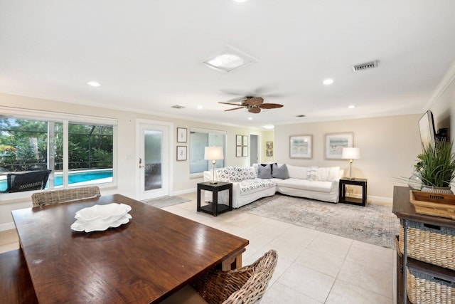 tiled living room featuring crown molding and ceiling fan