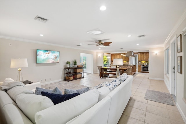 living room featuring light tile patterned flooring and ornamental molding