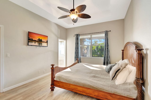 bedroom with ceiling fan and light hardwood / wood-style flooring