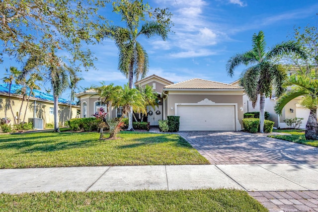 view of front of house with a front lawn and a garage