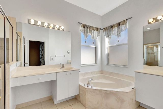 bathroom with tile patterned floors, independent shower and bath, and vanity