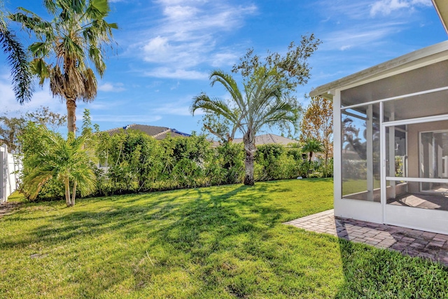 view of yard with a sunroom