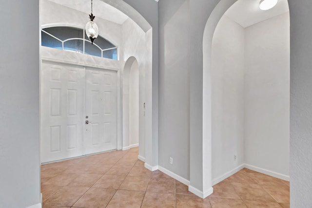 foyer featuring light tile patterned floors