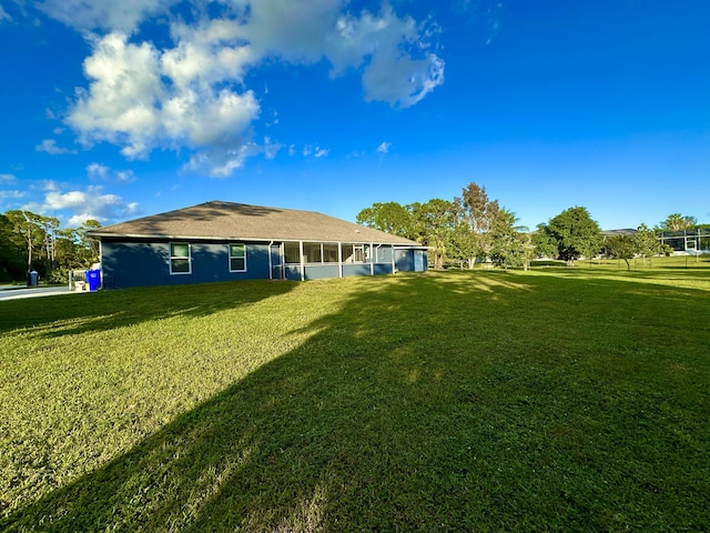 view of yard featuring a sunroom