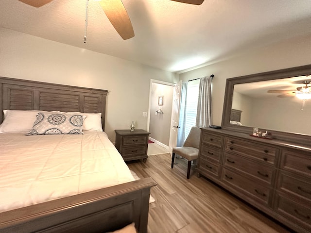 bedroom with ceiling fan and light wood-type flooring