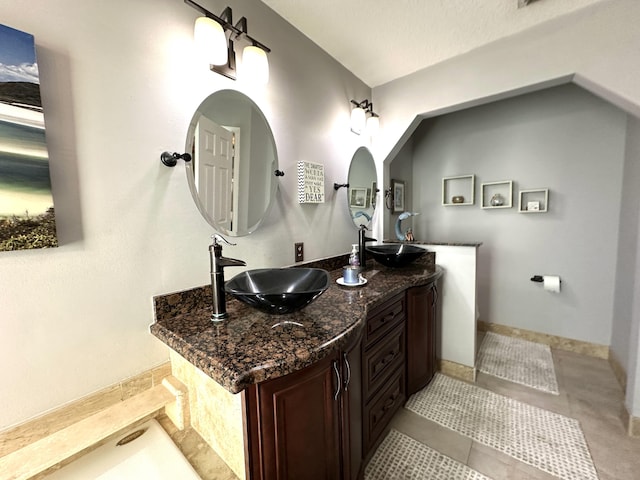 bathroom with vanity and tile patterned floors