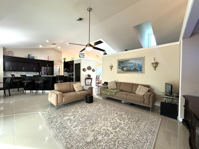 living room featuring ceiling fan and high vaulted ceiling