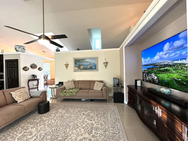 tiled living room with ceiling fan and high vaulted ceiling