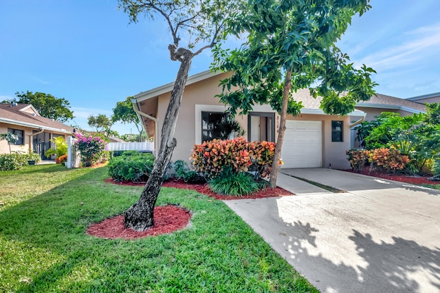 view of front of home featuring a garage and a front lawn