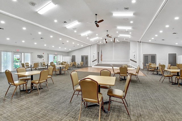 dining room featuring a textured ceiling, ceiling fan, carpet, and lofted ceiling