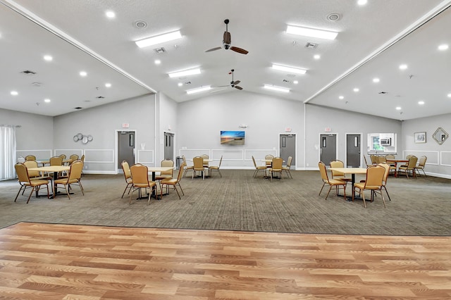 interior space featuring ceiling fan, light hardwood / wood-style floors, and lofted ceiling