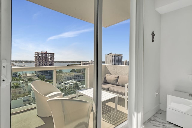 balcony featuring a water view