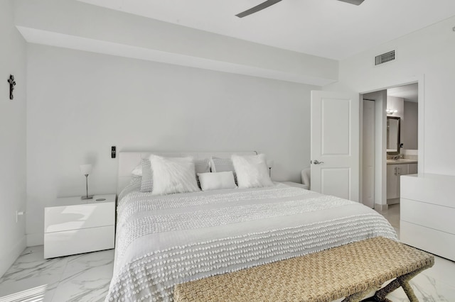 bedroom with a sink, ensuite bath, marble finish floor, visible vents, and a ceiling fan