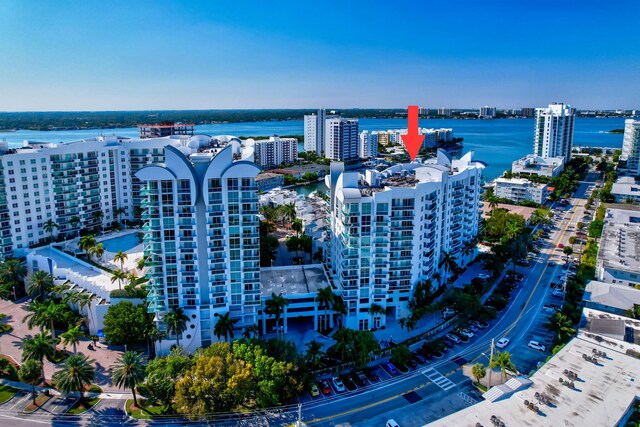 birds eye view of property with a water view