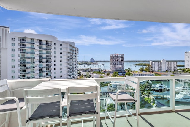 balcony featuring a water view