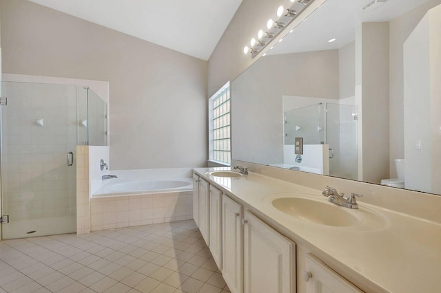 full bathroom featuring tile patterned floors, shower with separate bathtub, vaulted ceiling, and toilet