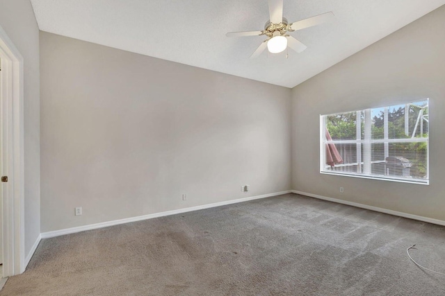 empty room with carpet, ceiling fan, and lofted ceiling