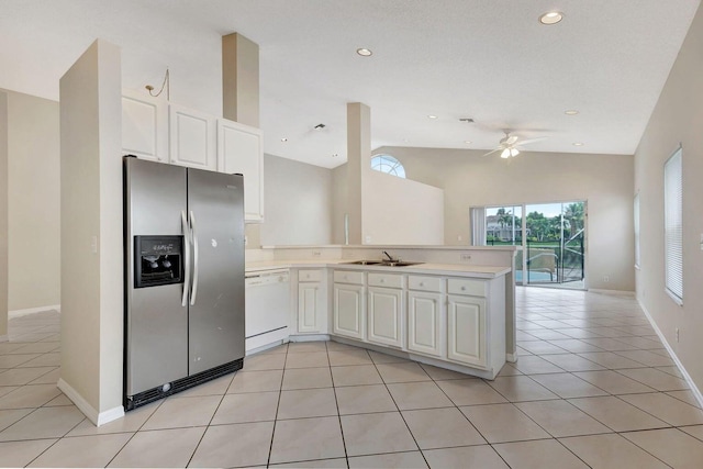 kitchen with kitchen peninsula, white dishwasher, ceiling fan, light tile patterned floors, and stainless steel fridge with ice dispenser