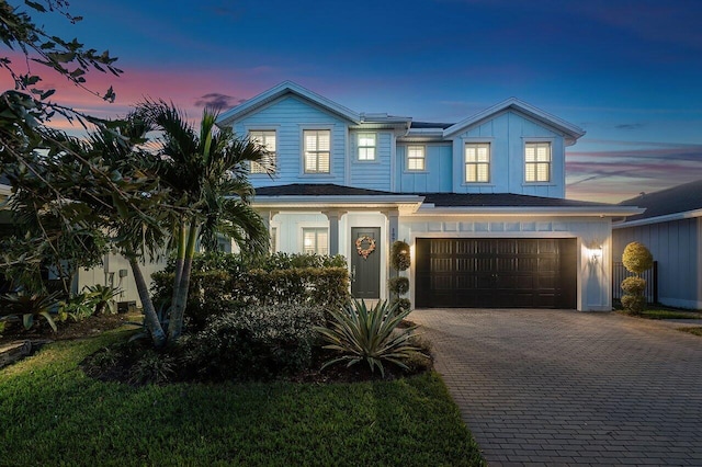 view of front of property with a garage