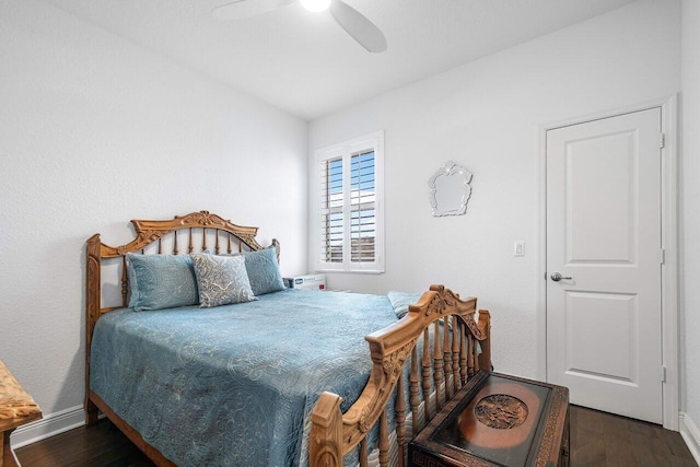 bedroom with ceiling fan and dark wood-type flooring