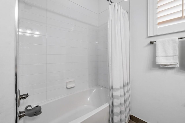 bathroom featuring shower / bath combination with curtain