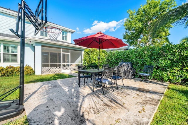 view of patio with a sunroom