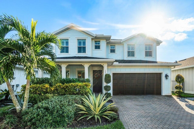 view of front of property with a garage