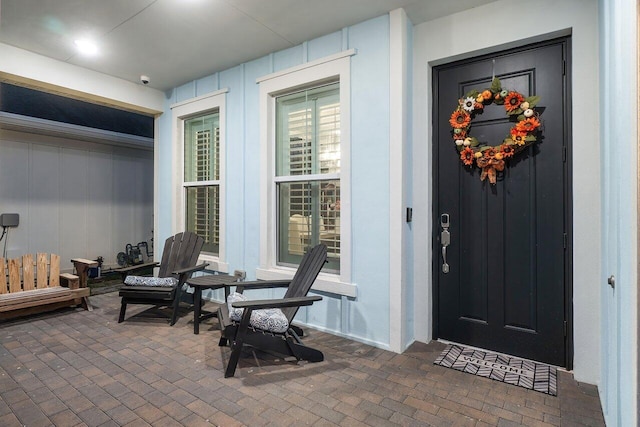 doorway to property featuring a porch