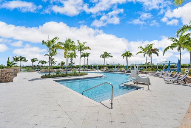 view of swimming pool with a patio