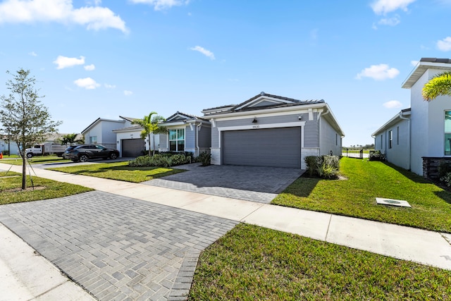 ranch-style house featuring a front yard and a garage