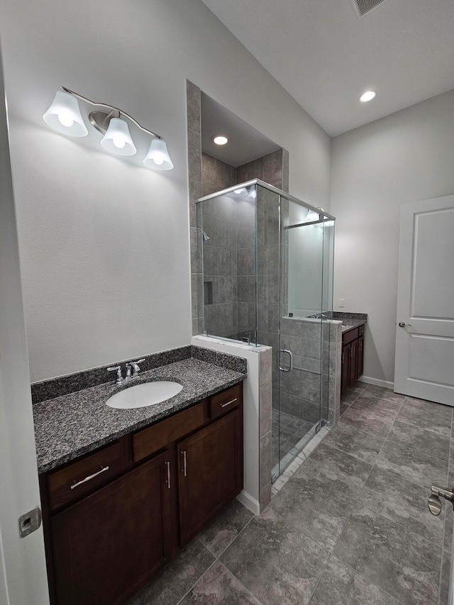 bathroom featuring vanity and walk in shower