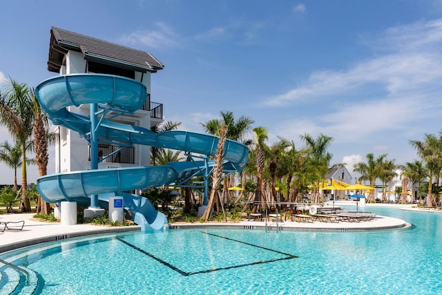 view of swimming pool featuring a water slide