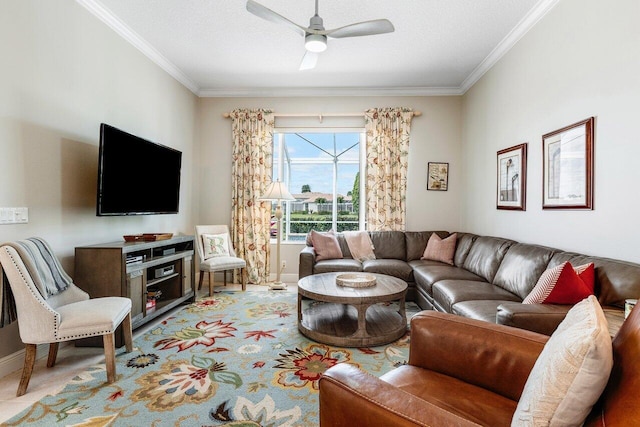 living room with ceiling fan, ornamental molding, and a textured ceiling