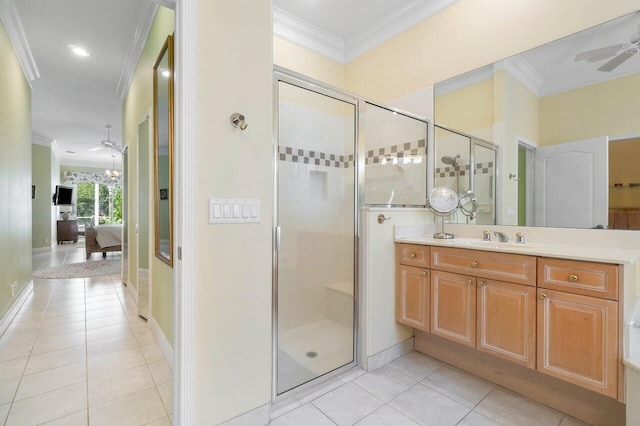 bathroom featuring ceiling fan, tile patterned flooring, and ornamental molding