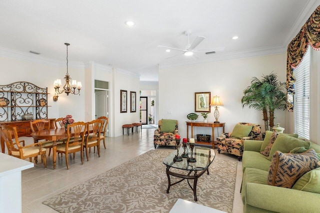 tiled living room with ceiling fan with notable chandelier and ornamental molding