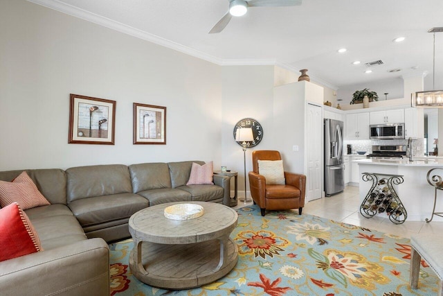 living room featuring light tile patterned floors, ceiling fan, and ornamental molding