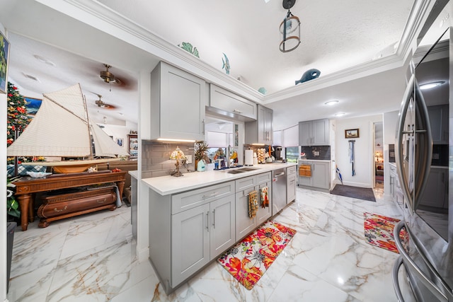 kitchen featuring tasteful backsplash, gray cabinetry, a textured ceiling, and appliances with stainless steel finishes