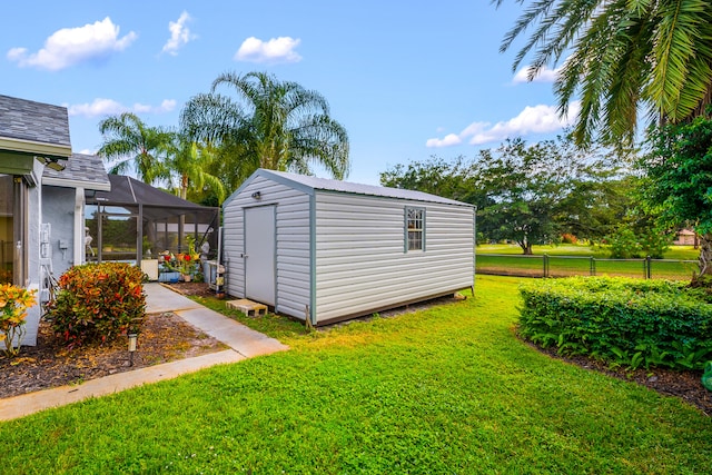 view of outbuilding featuring a lawn