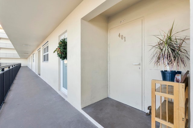 entrance to property with a balcony