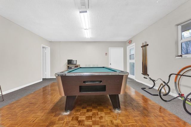 game room featuring a textured ceiling and billiards